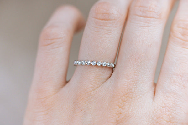 BERTOLLE || half-eternity bezel diamond band
